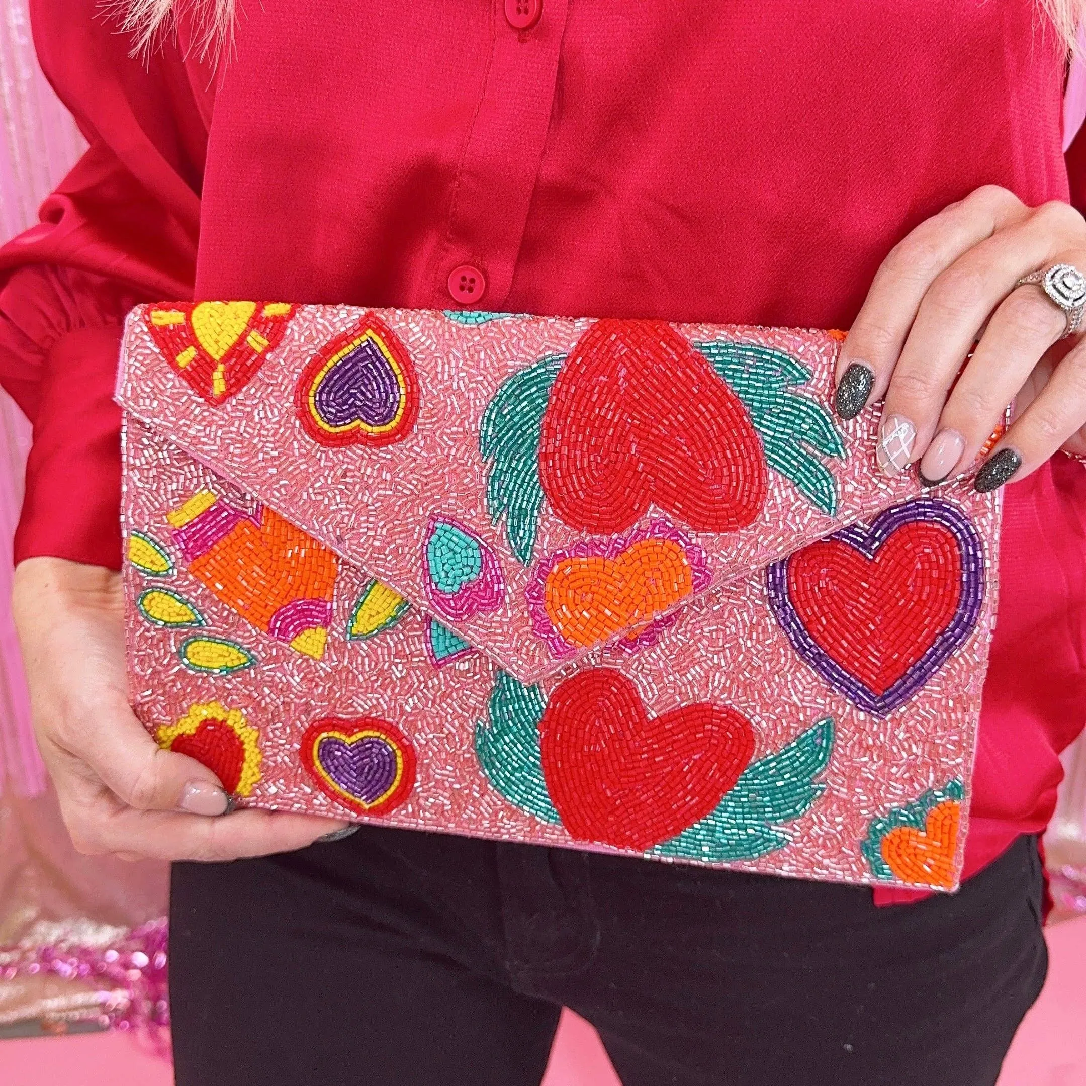 Wing heart beaded clutch